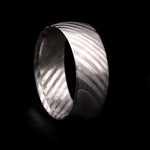 Austenitic stainless steel Damascus ring with a flowing pattern, handmade by Thornhill Jewellery