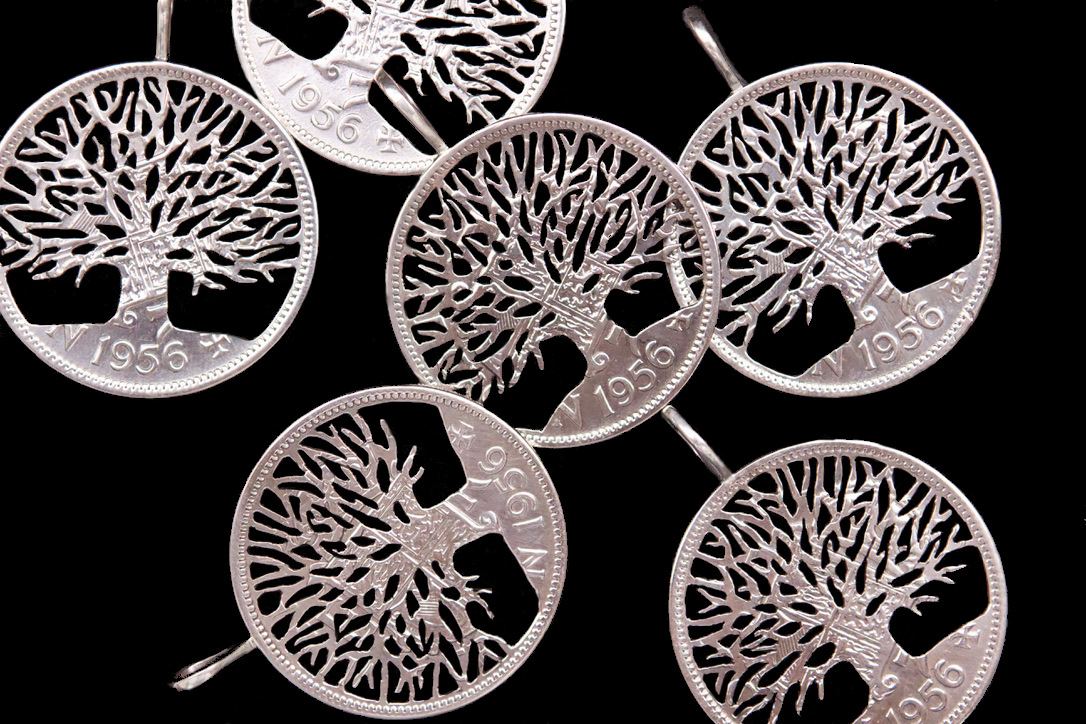 Hand cut Tree of Life pendants from 1956 half crown coins