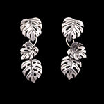 Sterling Silver leaf-shaped earrings. Each earring is composed from 3 monstera leaves.