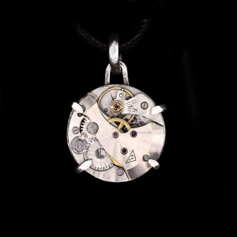 Steampunk pendant made from a vintage watch movement set in sterling silver