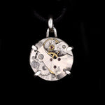 Steampunk pendant made from a vintage watch movement set in sterling silver