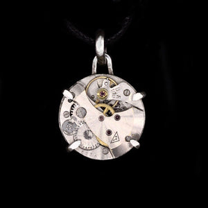 Steampunk pendant made from a vintage watch movement set in sterling silver