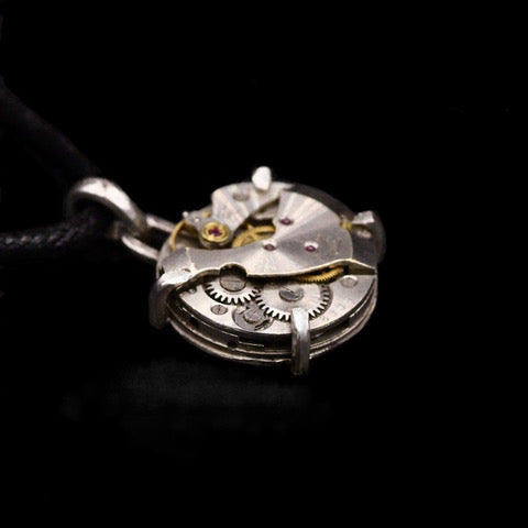 Steampunk pendant made from a vintage watch movement set in sterling silver