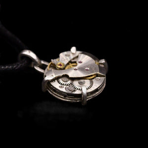 Steampunk pendant made from a vintage watch movement set in sterling silver